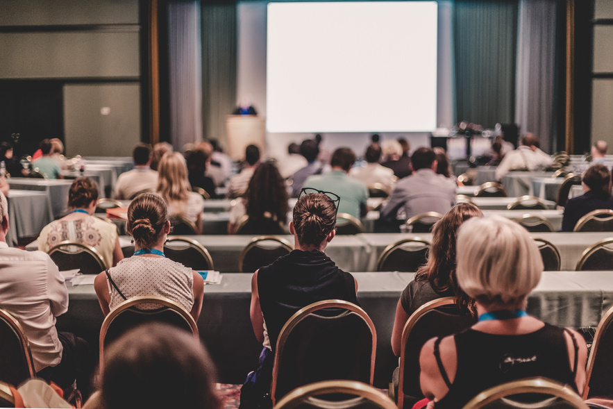 Audience in Lecture Hall at Business Conference